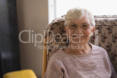 Front view of senior woman looking at camera in nursing home