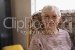 Front view of senior woman looking at camera in nursing home