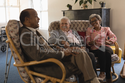 Group of senior friends interacting with each other at nursing home