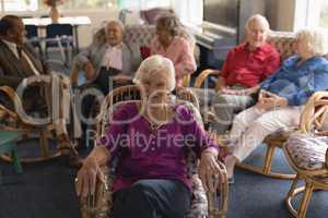 Front view of senior woman looking at camera in nursing home