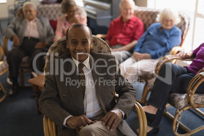 Front view of senior man looking at camera in nursing home