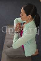 Young beautiful woman doing yoga in fitness studio