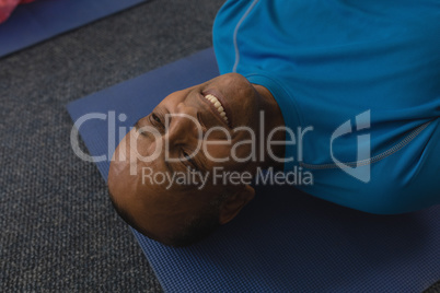 Close-up of senior man exercising in fitness studio