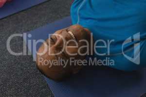 Close-up of senior man exercising in fitness studio