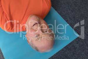 Close-up of senior man exercising in fitness studio