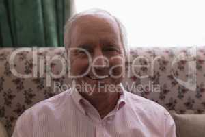 Senior man relaxing in living room at home