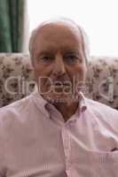 Senior man relaxing in living room at home