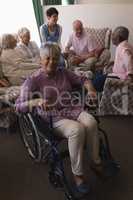 Disabled senior woman smiling in living room