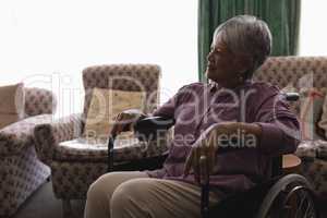 Disabled senior woman relaxing at home