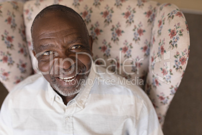 Senior man relaxing in living room at home