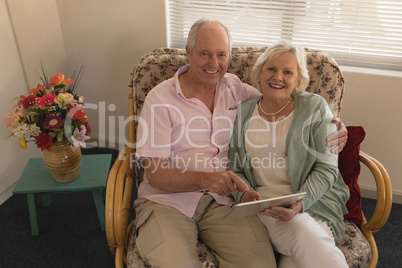 Senior couple using digital tablet at nursing home