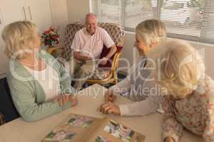 Group of senior people interacting with each other at nursing home