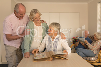 Group of senior people interacting with each other at nursing home