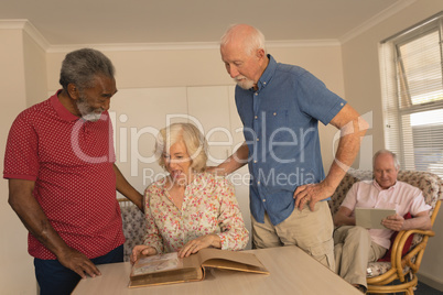 Group of senior people interacting with each other at nursing home