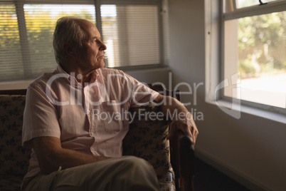 Senior man relaxing in living room at home