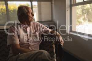 Senior man relaxing in living room at home