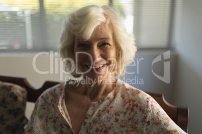 Senior woman relaxing in living room at home