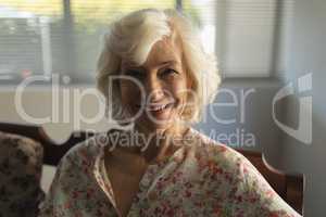 Senior woman relaxing in living room at home