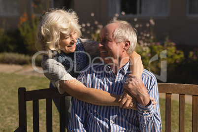 Senior couple embracing each other in the park