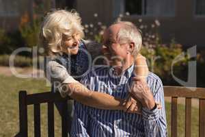 Senior couple embracing each other in the park