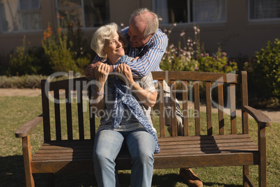 Senior couple embracing each other in the park