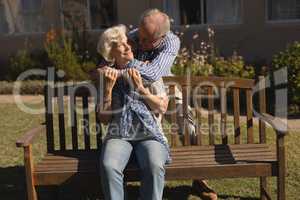 Senior couple embracing each other in the park