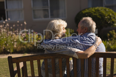 Senior couple embracing each other in the park