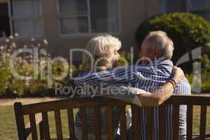 Senior couple embracing each other in the park