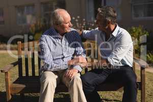 Senior men talking with each other in the park