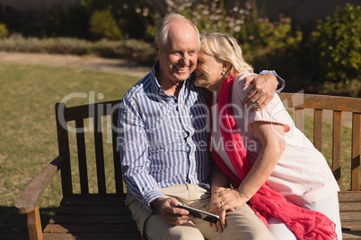 Senior couple embracing each other in the park