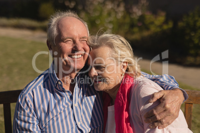 Senior couple embracing each other in the park