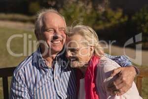 Senior couple embracing each other in the park