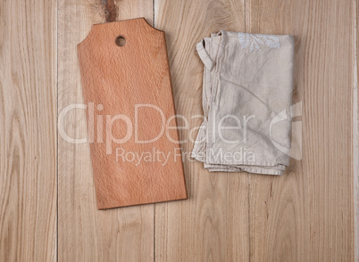 wooden rectangular cutting board and kitchen towel