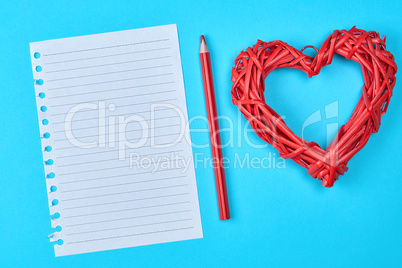 blank white piece of paper in a line and a red wooden pencil