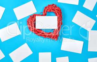 wooden wicker red heart and empty white paper business cards