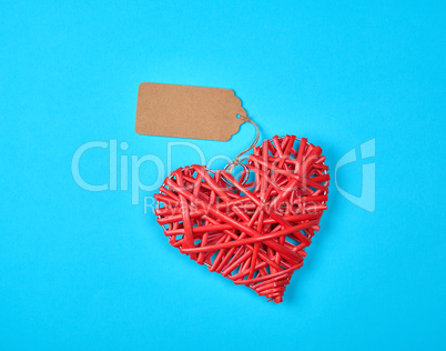 wooden wicker red heart with an empty brown tag
