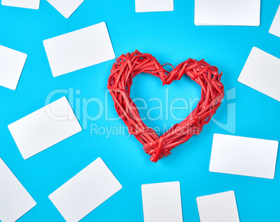 wooden wicker red heart and empty white paper business cards
