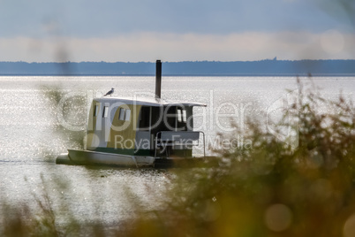 Floating sauna with seagul in the sea.