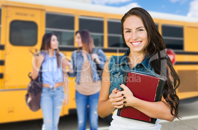 Young Female Student with Books Near School Bus