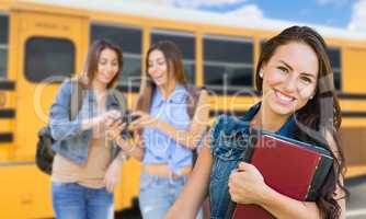 Young Female Student with Books Near School Bus