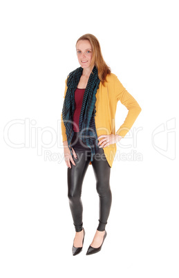 Slim young woman standing, smiling