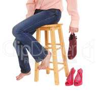Close up of woman sitting on chair with shoes