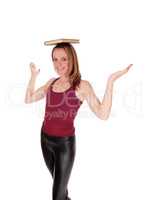 Woman balancing a book on her head
