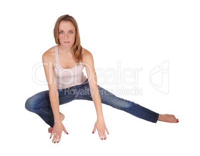 Young woman crouching on the floor