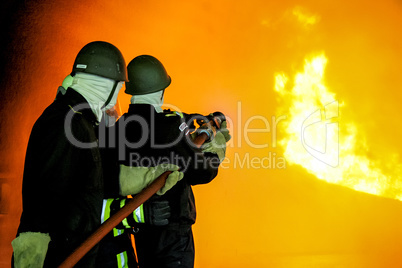 Firefighters training for fire fighting.