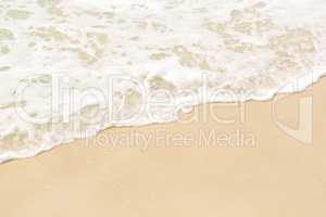 Tropical beach background with soft wave and sand