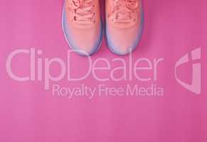 pair of  pink sneakers with  laces