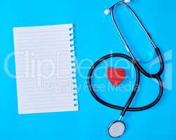 blank white piece of paper in a line and a medical stethoscope