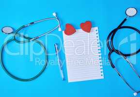 blank paper sheet  and medical stethoscope