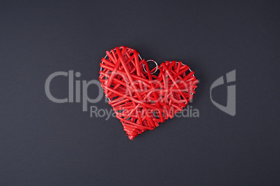 decorative red wicker heart on a black background